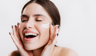 Woman Applying Face Cream
